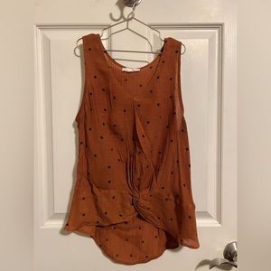 Sweet little sheer rust orange tank top with small black print design
